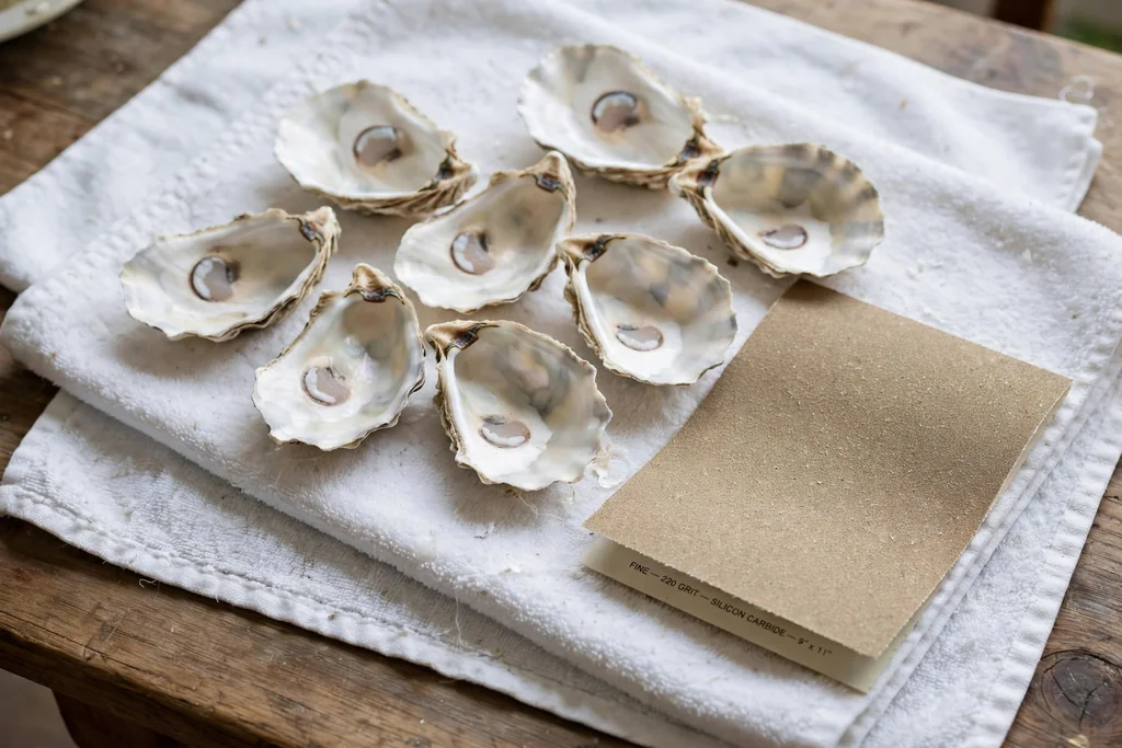 Clean oyster shells drying inner side up on towels.