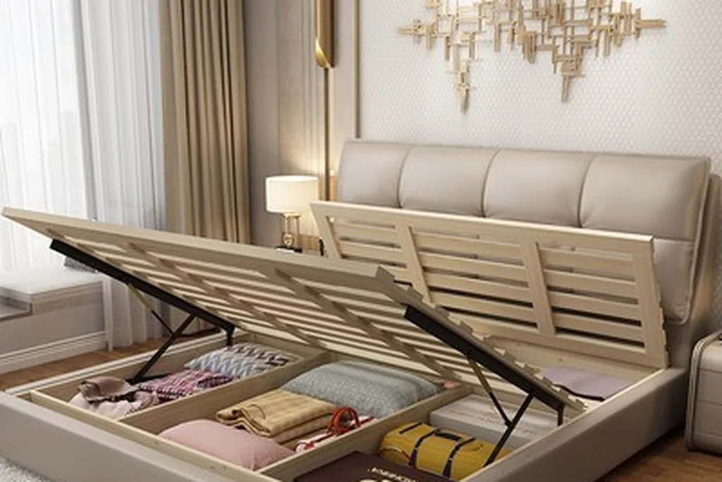 Storage bed with a lift up base open, showing folded blankets inside.