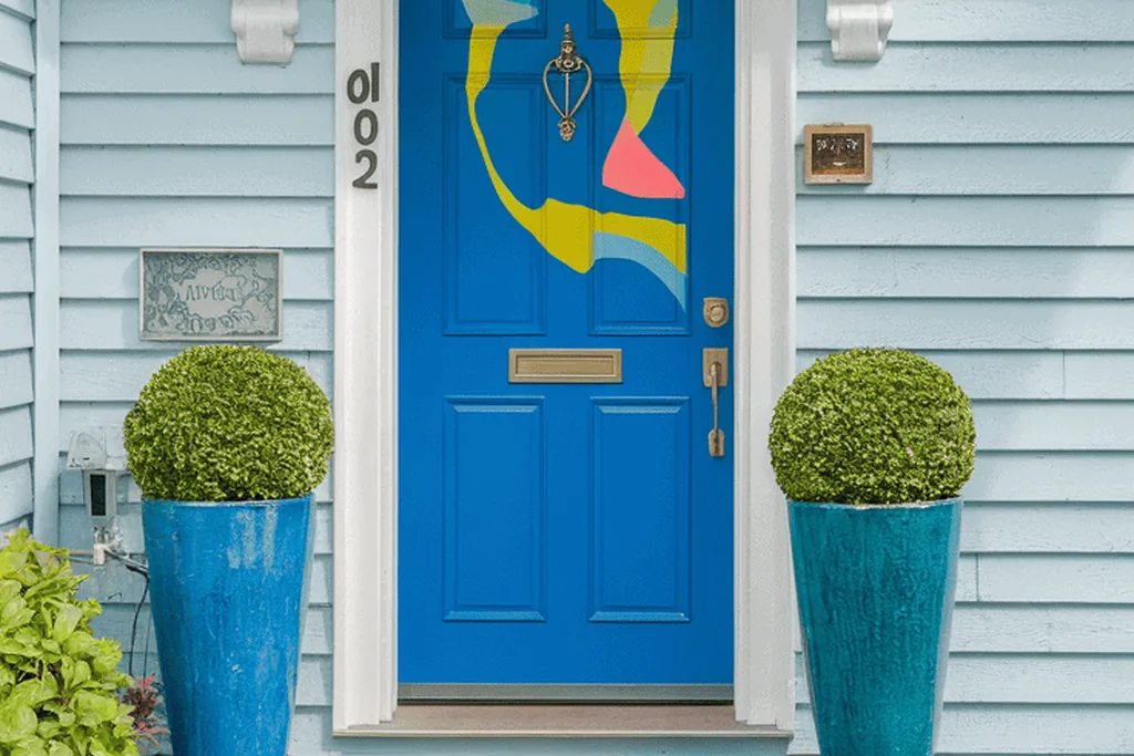 Front door painted clear delft blue with a white frame.
