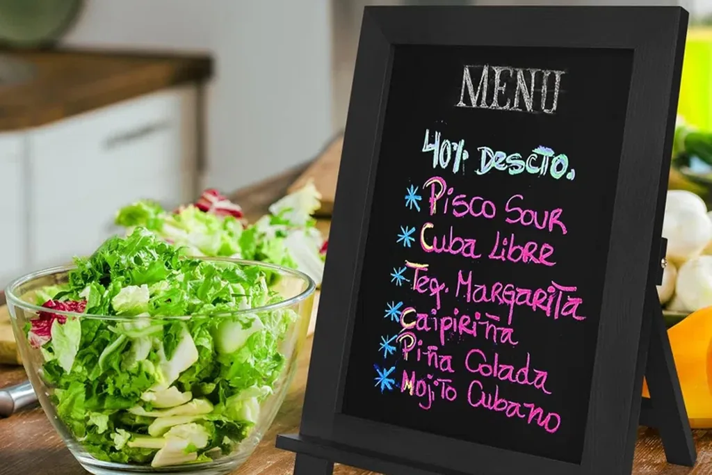 Small framed chalkboard with a handwritten menu on a kitchen counter.