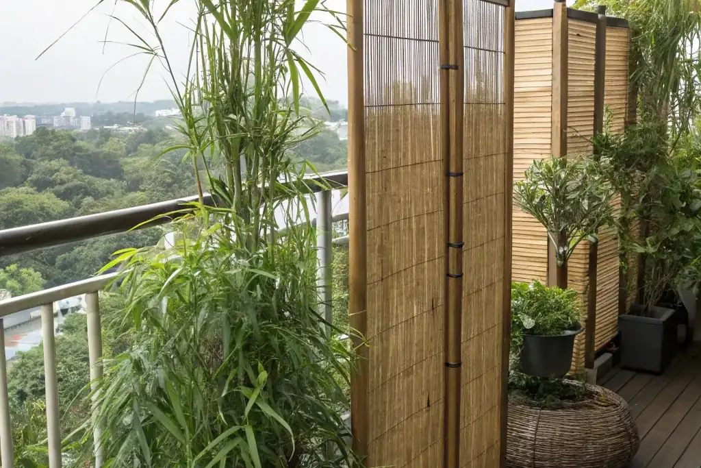 Bamboo screen fixed to a balcony railing.