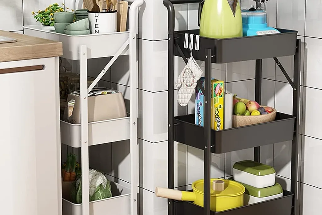 Rolling kitchen carts with shelves holding kitchen items and a watering can.