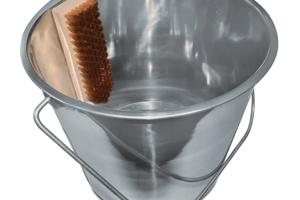 Stainless steel wash-up bucket with a brush inside.