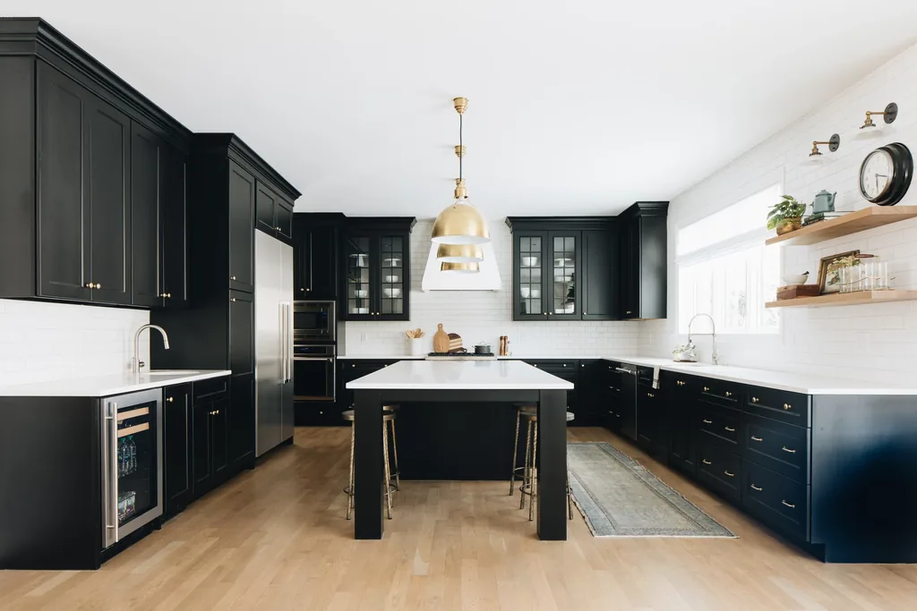 Kitchen with matte black cabinets and a light backsplash.