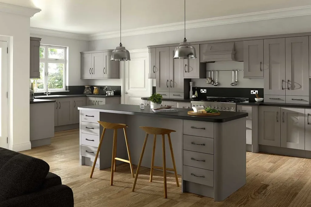 Kitchen with stone gray cabinets and a concrete look counter.