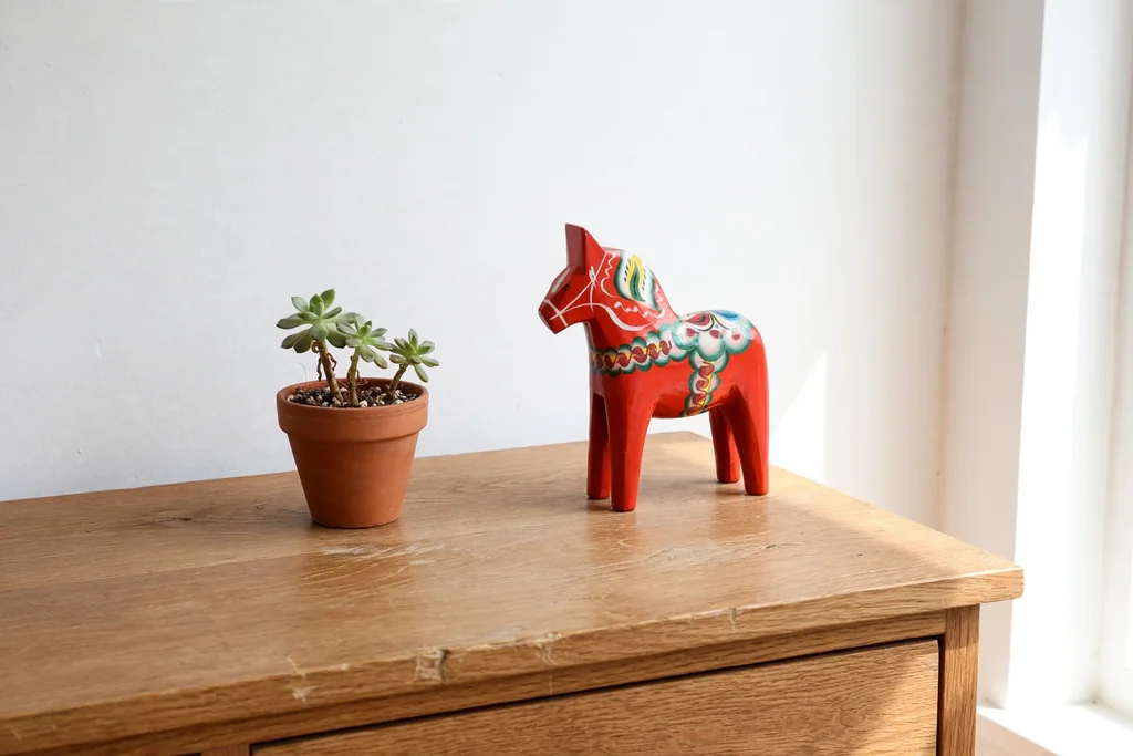 Bedroom dresser with a small painted Dala horse accent.