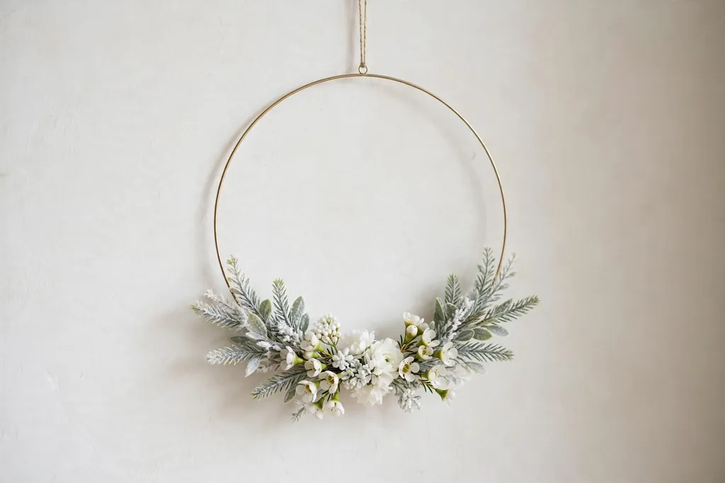 Minimal hoop wreath with white flowers on the lower third.
