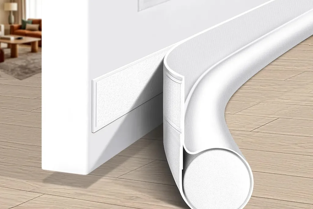 Draft stopper along the bottom of a bedroom door.