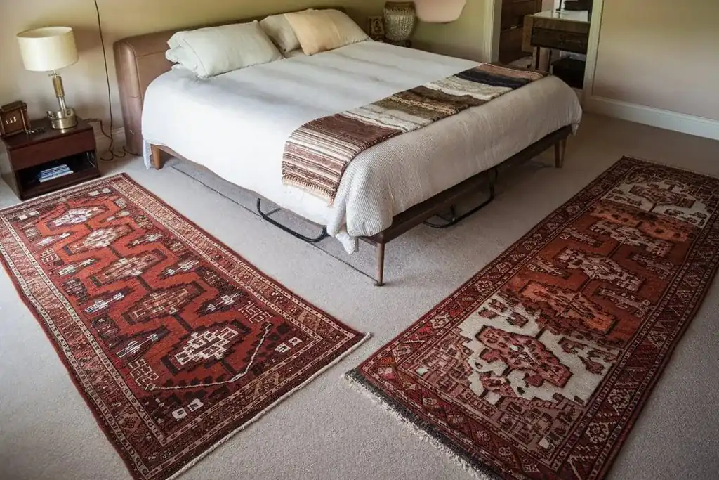 Runners on both sides of a bed with nightstands.