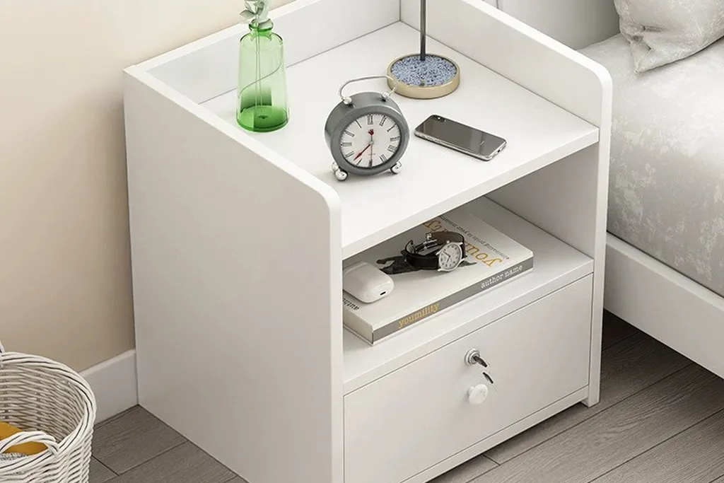Nightstand with a closed storage box and a lamp.